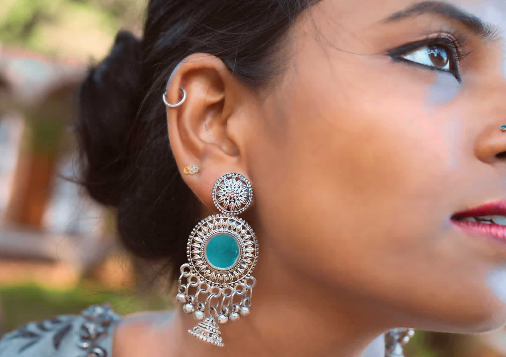 Can I Wear Big Earrings with a Silver Necklace?